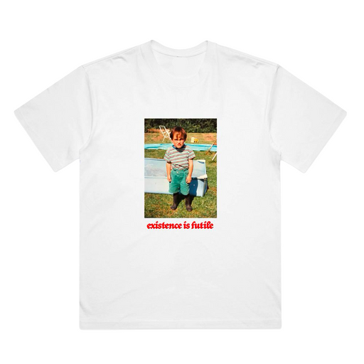 White t-shirt with a printed design of a grumpy child and red text reading 'existence is futile'
