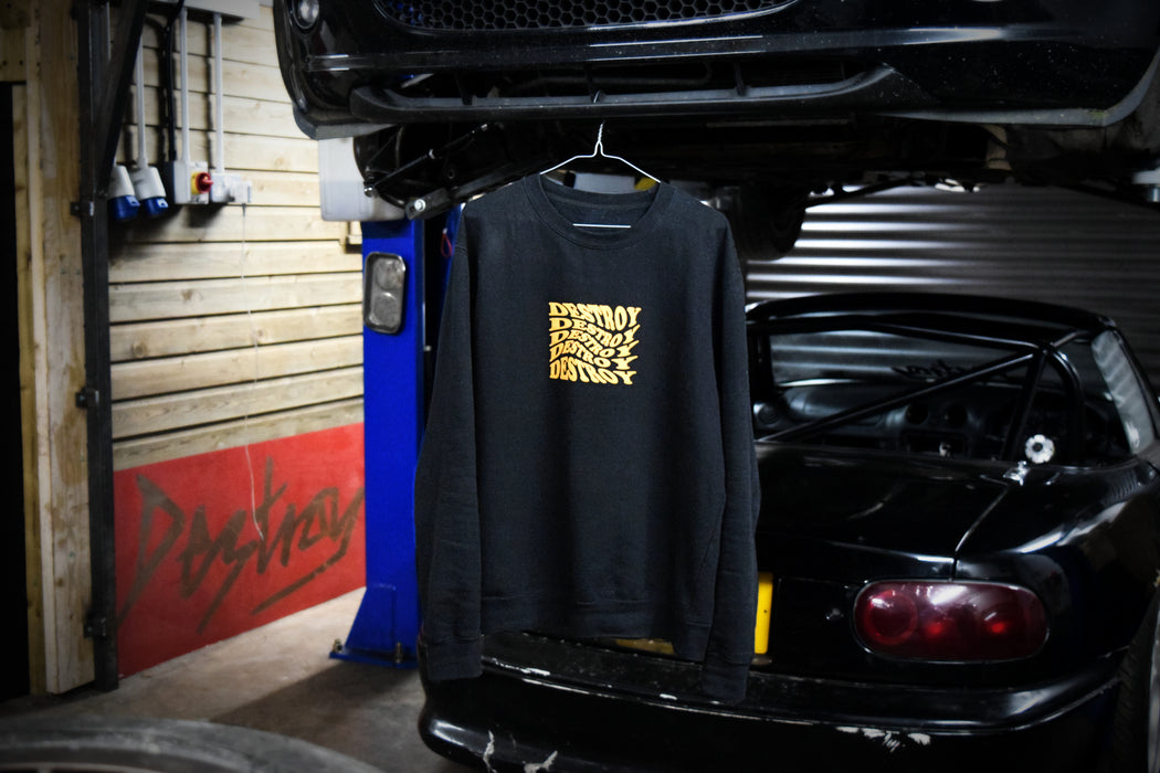 Destroy or Die black and yellow twisted logo jumper sweater